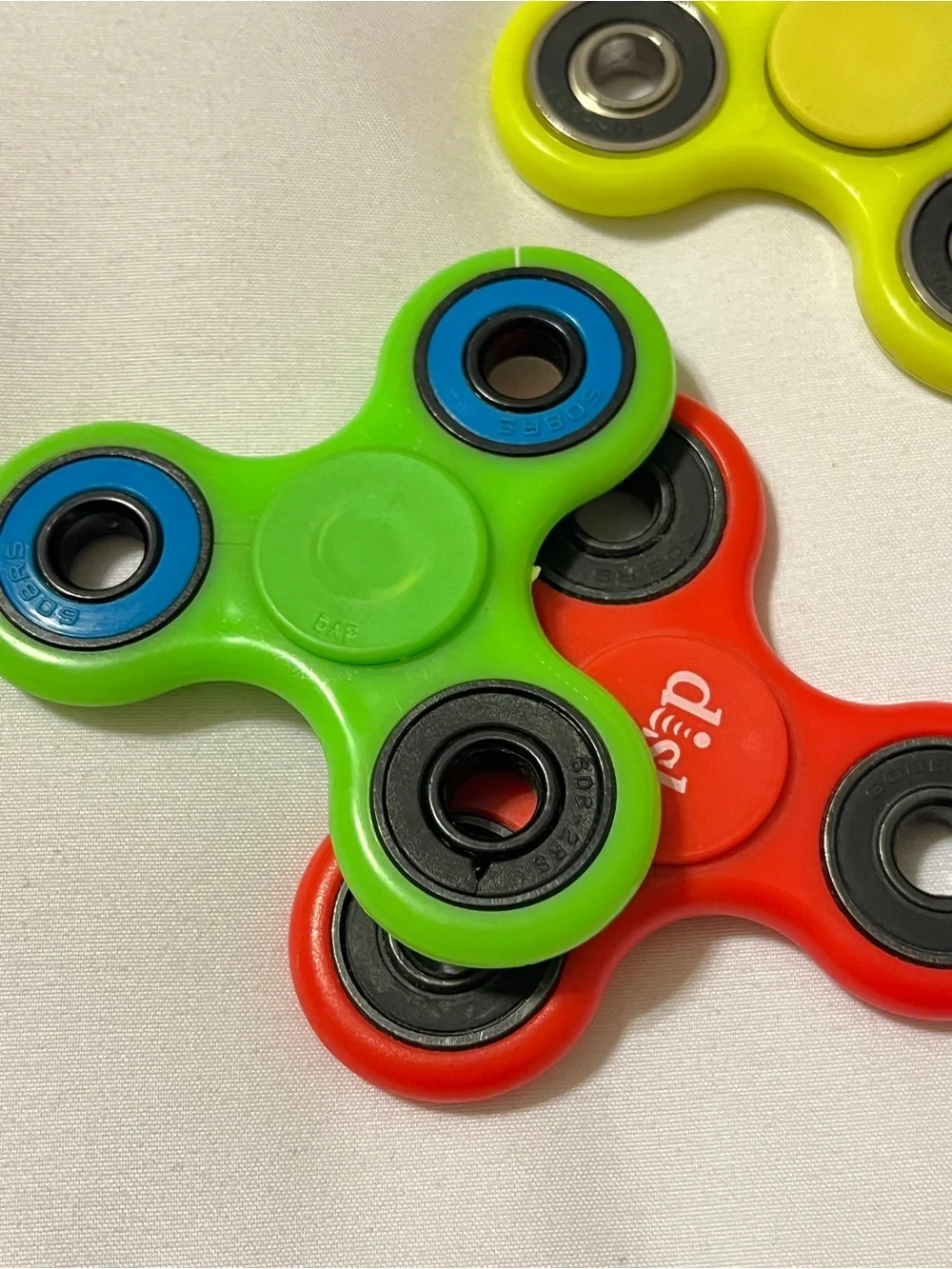 Lot of 3 Fidget Spinners ESPN Dish Network Plastic Toy Red Green Yellow